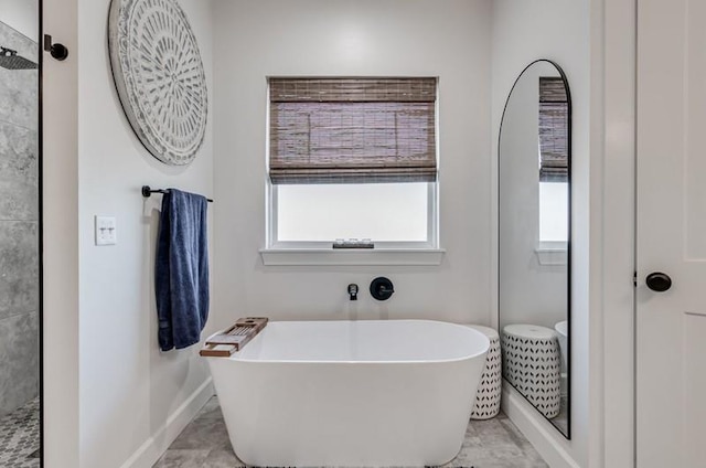 bathroom featuring shower with separate bathtub, tile patterned floors, and plenty of natural light