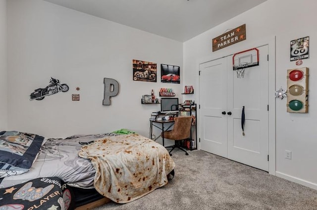 bedroom with a closet and light carpet