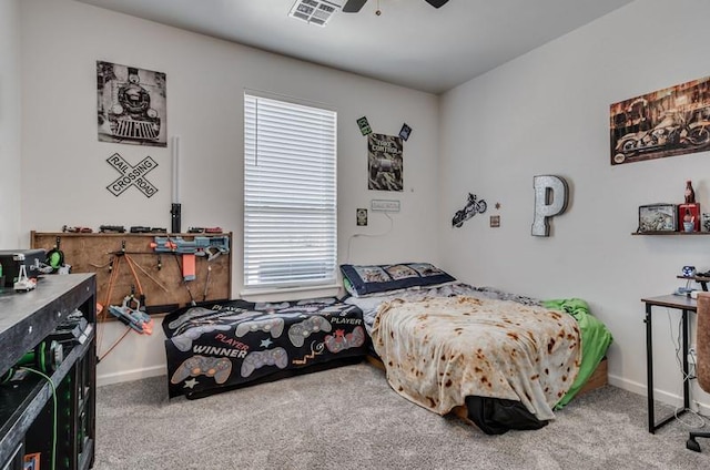 bedroom featuring ceiling fan, multiple windows, and carpet