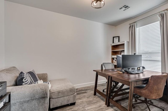 home office featuring light hardwood / wood-style floors