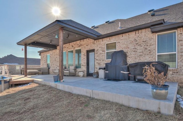 back of property featuring ceiling fan, a patio, and a deck