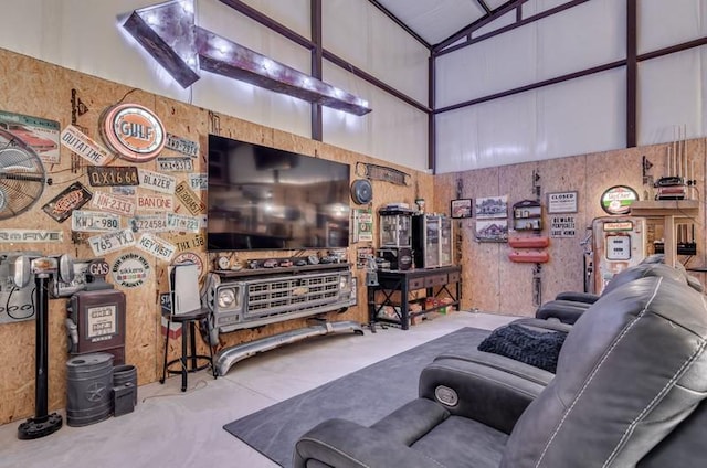 living room featuring high vaulted ceiling