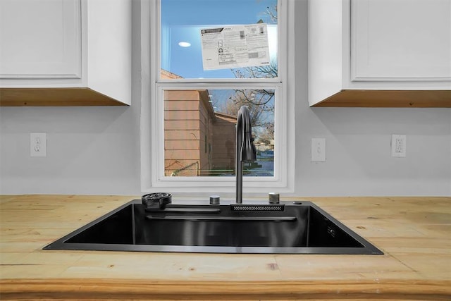 room details with sink and white cabinetry