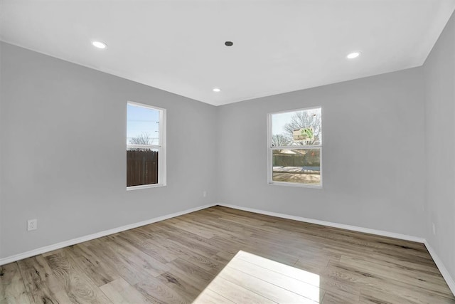 spare room featuring light hardwood / wood-style floors