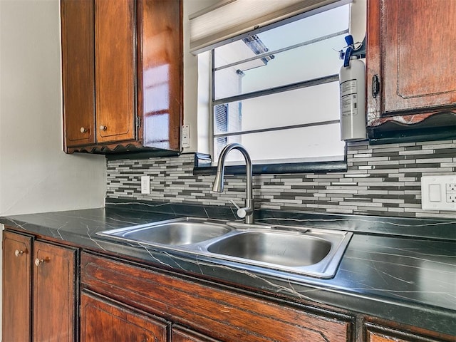 kitchen with sink and tasteful backsplash