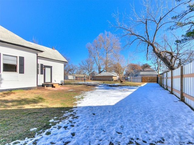 view of yard layered in snow