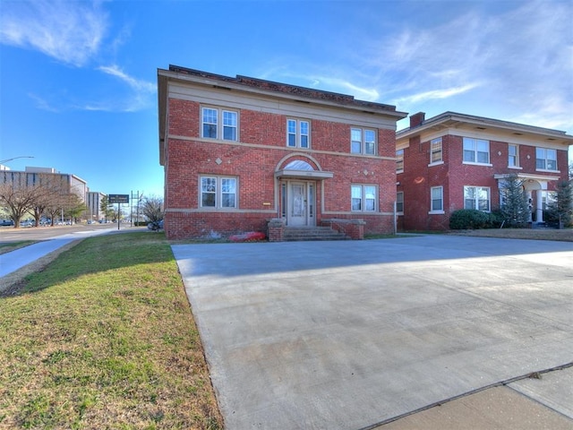 view of property featuring a front yard