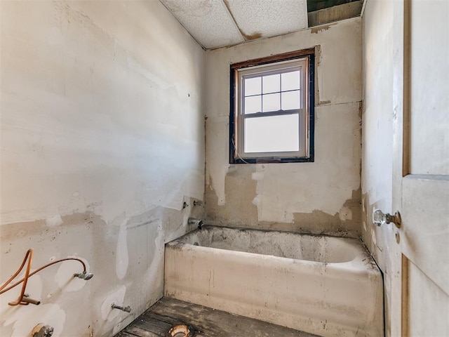 bathroom with a tub to relax in