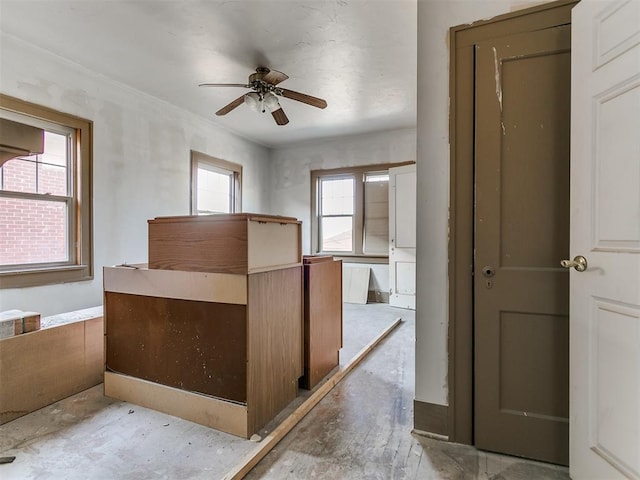 interior space featuring ceiling fan