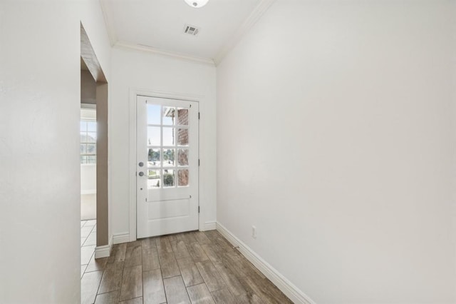 doorway to outside with ornamental molding