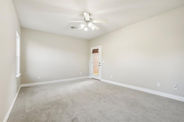 carpeted empty room with ceiling fan