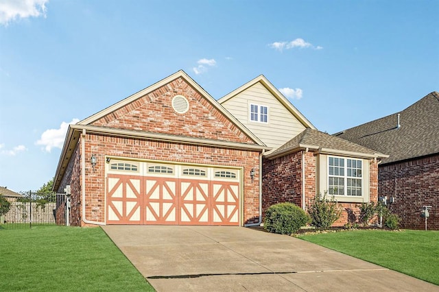 view of front of house with a garage and a front yard