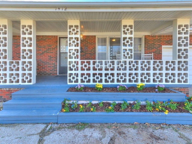 doorway to property featuring a porch