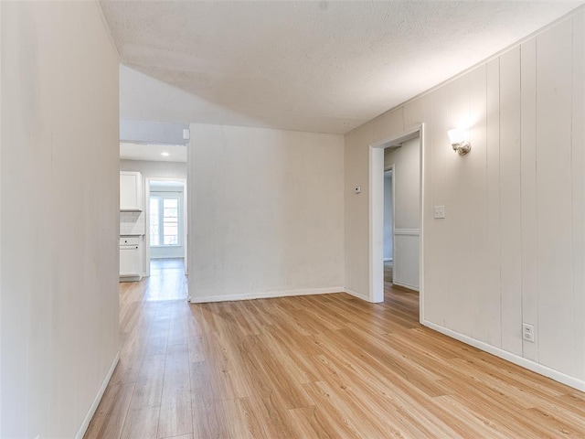 unfurnished room featuring light wood-type flooring