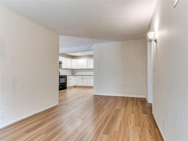 unfurnished living room featuring light hardwood / wood-style floors