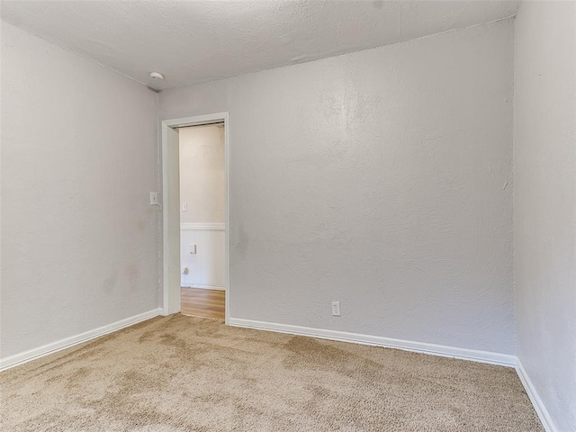 empty room with carpet flooring