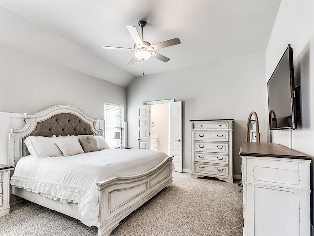 carpeted bedroom with ceiling fan and lofted ceiling