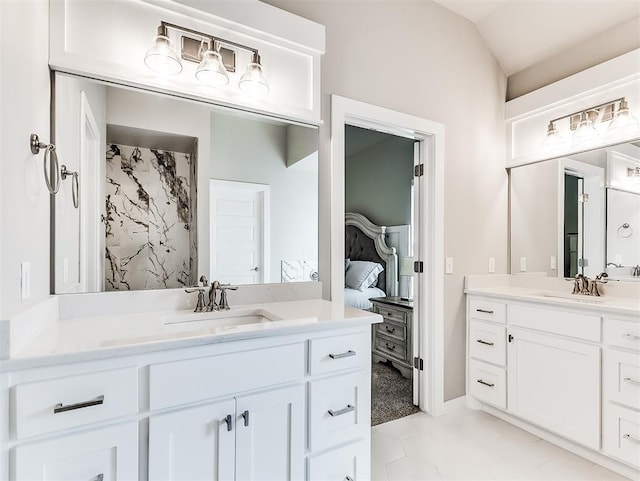 bathroom featuring vanity and vaulted ceiling