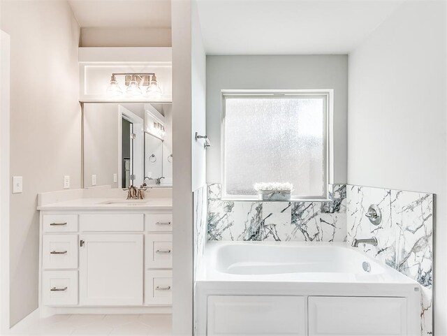 bathroom with a tub to relax in and vanity