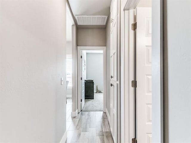 corridor featuring light hardwood / wood-style flooring