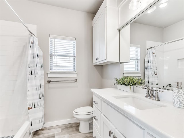 full bathroom featuring wood-type flooring, toilet, vanity, and shower / bathtub combination with curtain