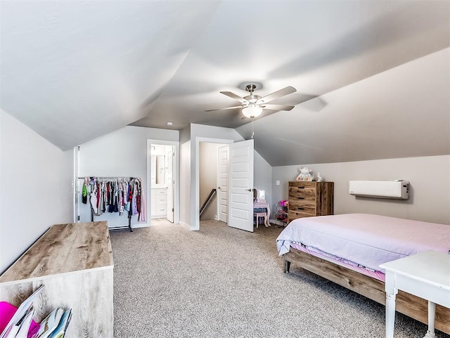 carpeted bedroom featuring ensuite bathroom, ceiling fan, and vaulted ceiling