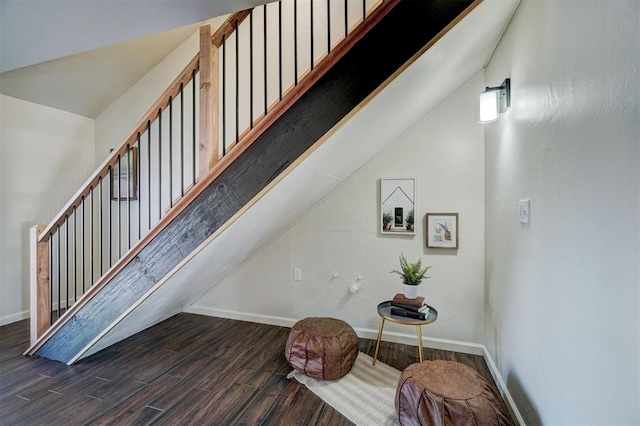 staircase with lofted ceiling