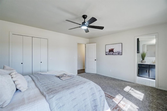 bedroom with ceiling fan, a closet, ensuite bath, and carpet flooring