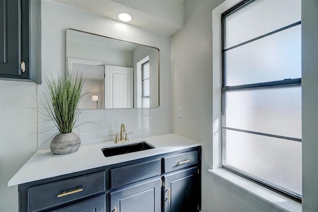 bathroom featuring vanity and a healthy amount of sunlight