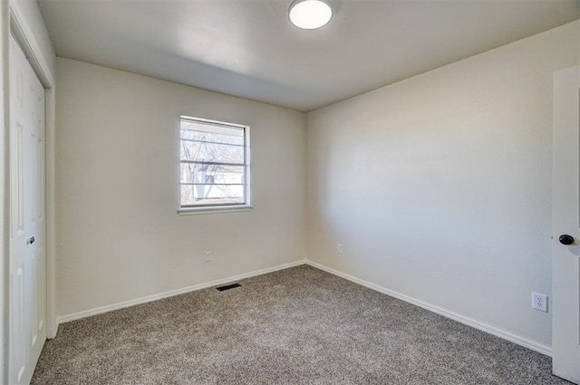 empty room featuring carpet floors