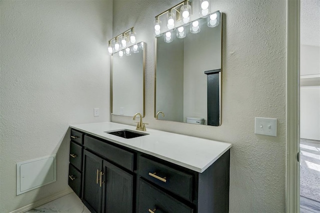 bathroom featuring toilet and vanity