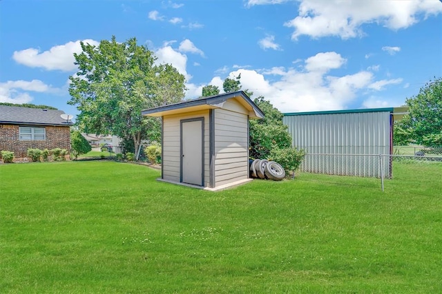 view of outbuilding featuring a yard