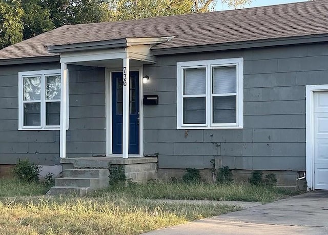 property entrance with a garage