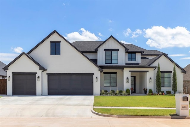 view of front of house featuring a garage and a front yard