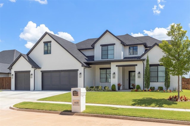 view of front of property featuring a garage and a front yard