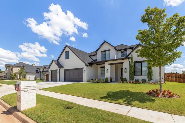 view of front of property with a front lawn and a garage