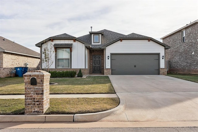 view of front of property with a front lawn and a garage