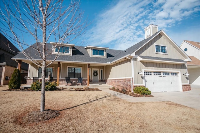 craftsman-style home with a garage and covered porch