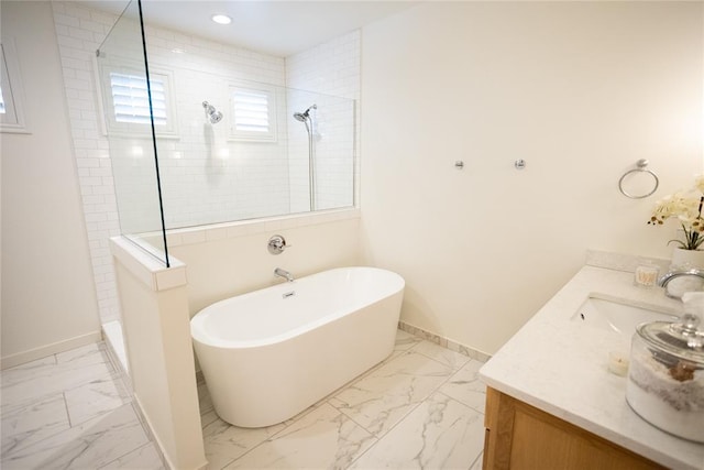 bathroom with vanity and independent shower and bath