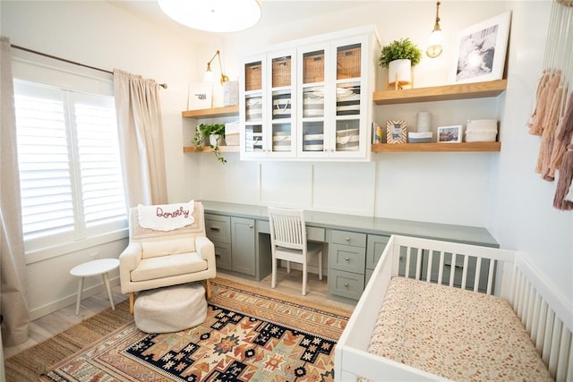 living area with a healthy amount of sunlight and built in desk