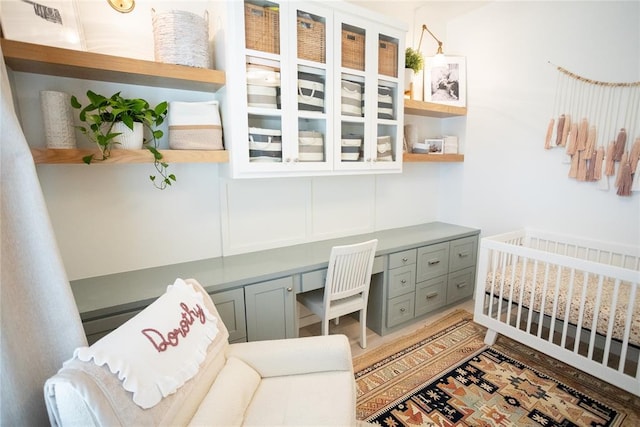 bedroom featuring built in desk