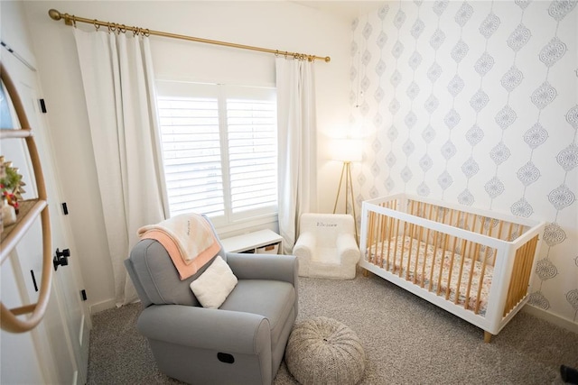 bedroom featuring a nursery area