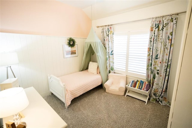 carpeted bedroom with vaulted ceiling