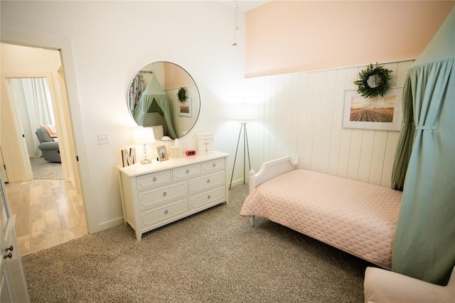 bedroom featuring light carpet