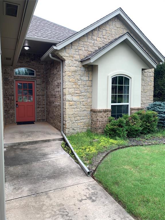 property entrance with a yard