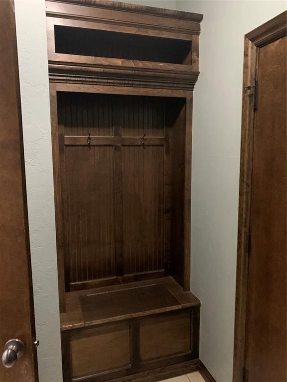 mudroom with light tile patterned floors