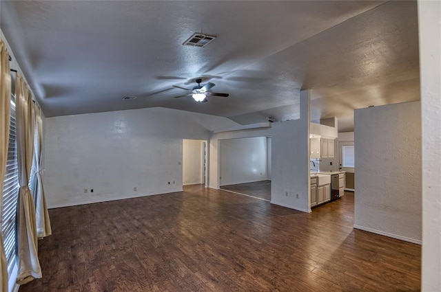 unfurnished living room with ceiling fan, lofted ceiling, and dark hardwood / wood-style floors