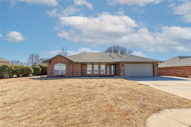 ranch-style house with a garage and a front yard