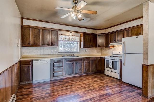 kitchen featuring dark wood-type flooring, baseboard heating, ceiling fan, and white appliances