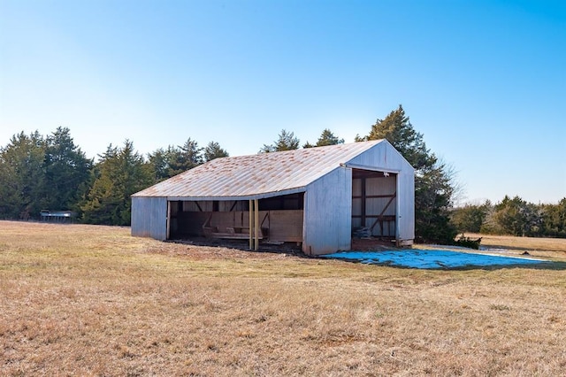 view of outbuilding with a yard